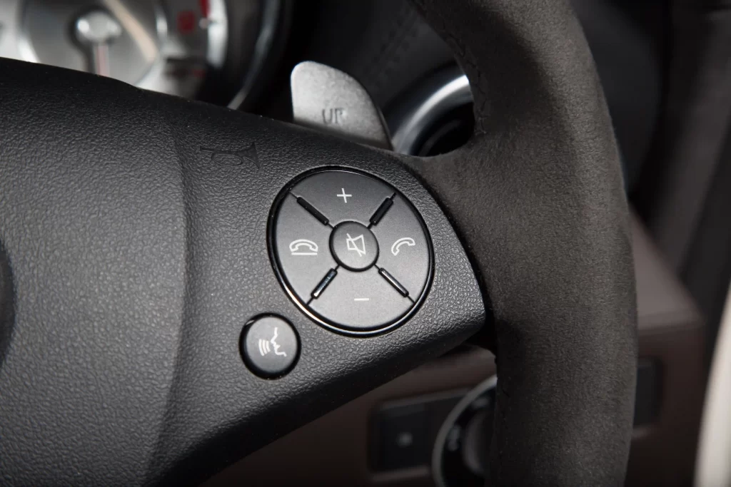 closeup-control-buttons-steering-wheel-luxury-car-lights