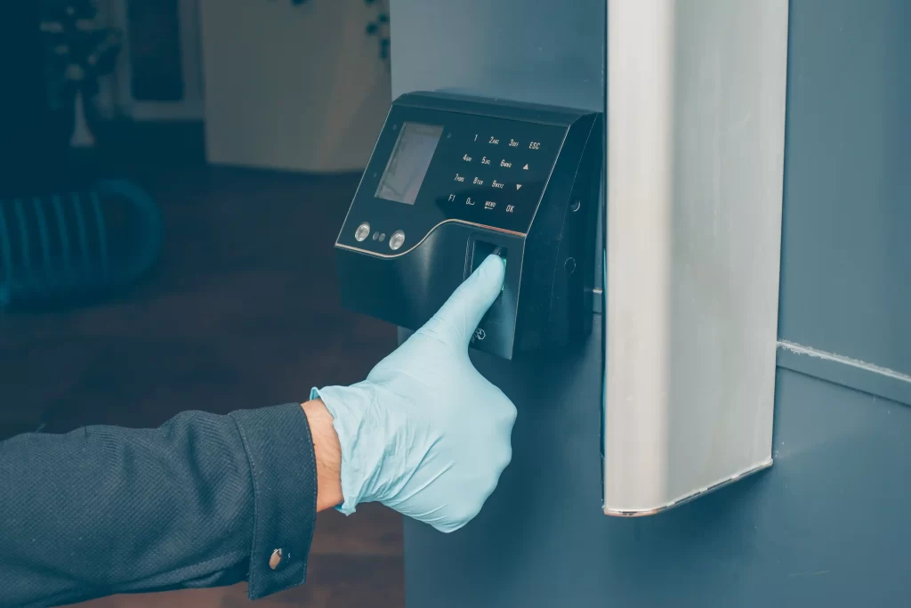 man-getting-intercom-read-his-fingerprint-open-door-with-gloves