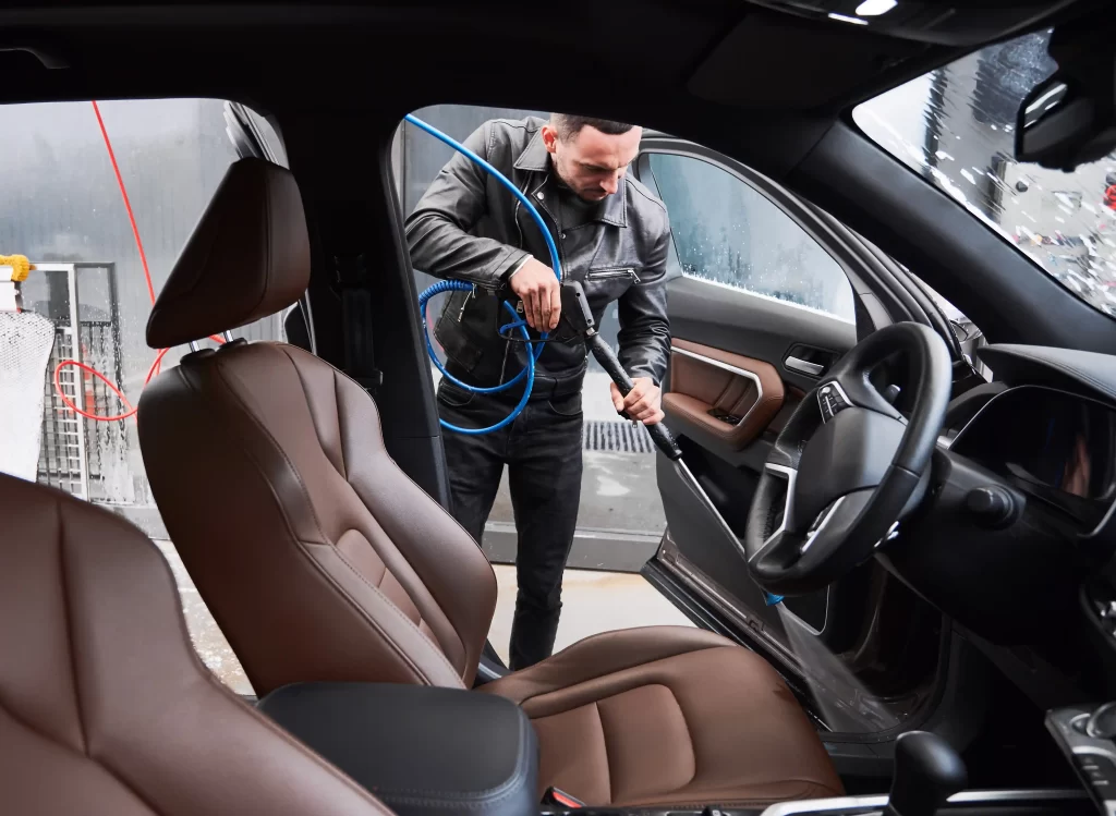 1-young-man-washing-car-carwash-station-outdoor